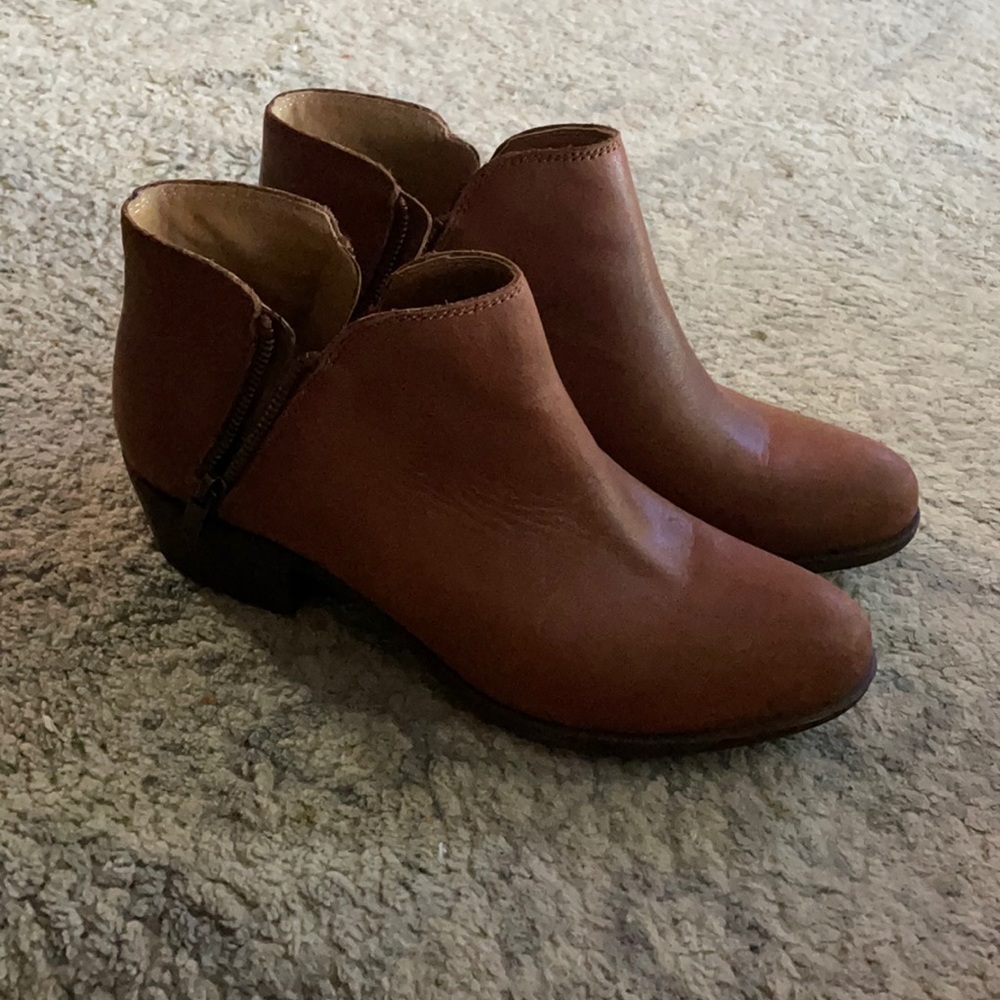 Not sure on the brand. Light brown leather material.